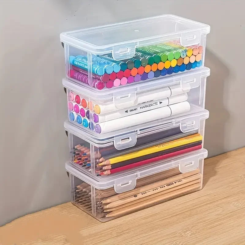 A stack of clear plastic storage boxes with lids containing various colored markers and pencils for office and craft supplies