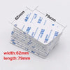 A stack of white double-sided foam mounting tape sheets with dimensions 62mm by 79mm.