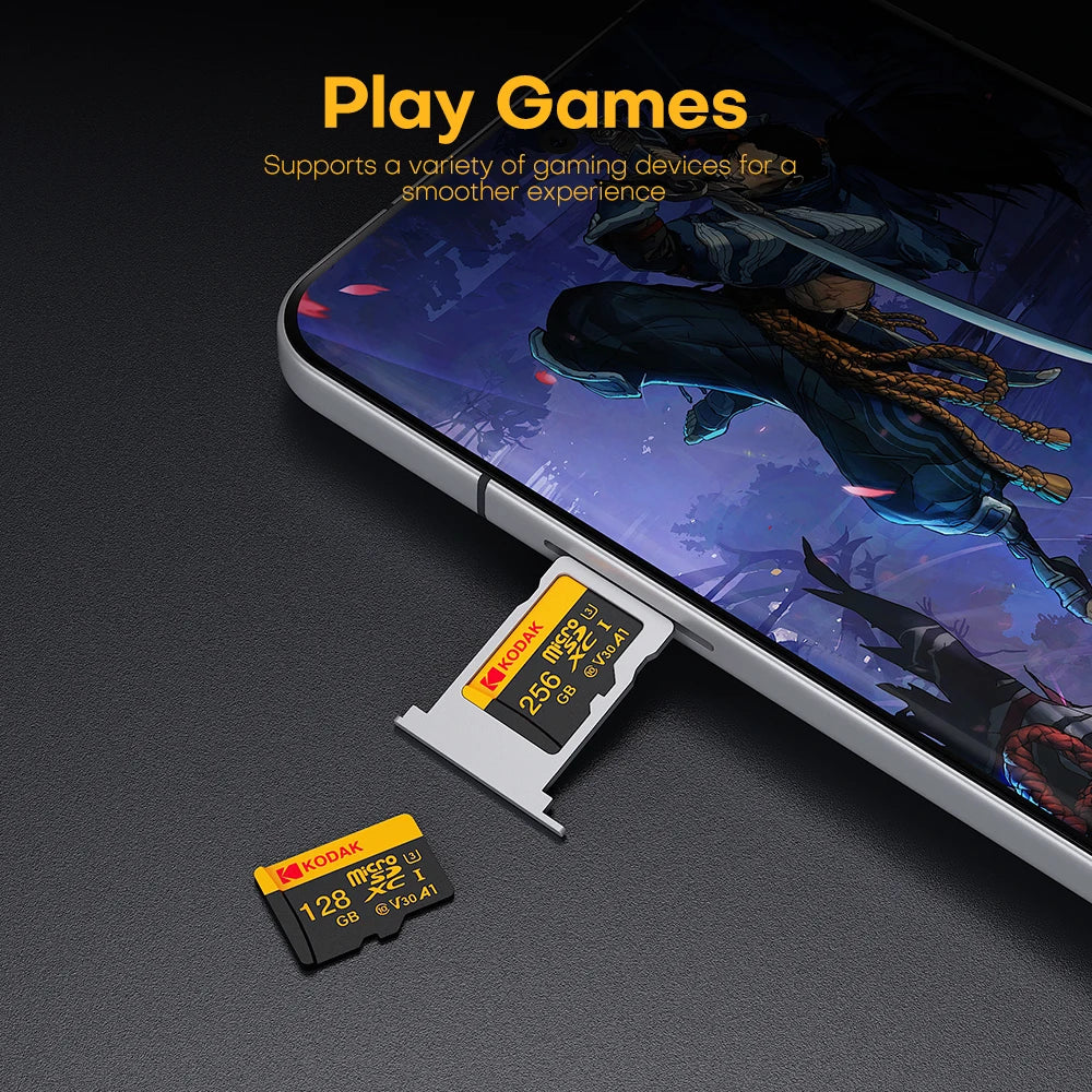 A close-up of a smartphone displaying a game, with two Kodak SD memory cards placed in front of it.
