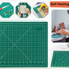 A set of tools and a green cutting mat showing the process for a double-sided self-healing sewing mat.