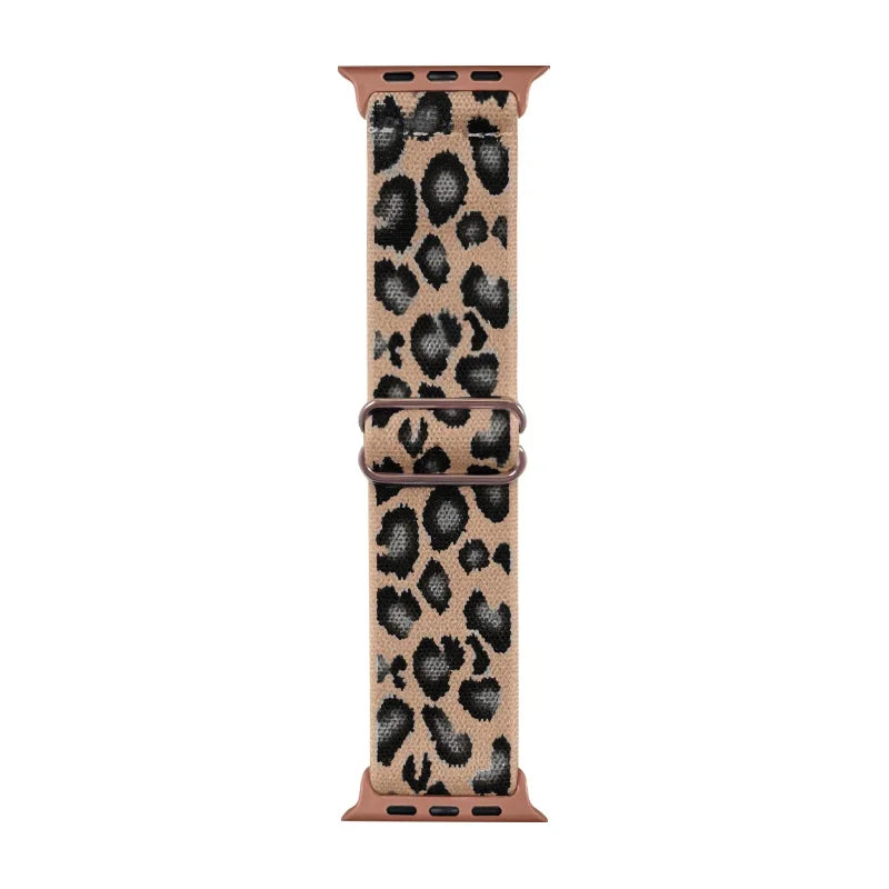 A brown leopard print nylon Apple Watch band with a rose gold buckle.