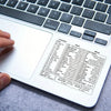 A close-up view of a laptop keyboard with vinyl shortcut stickers for Windows, Excel, and Word