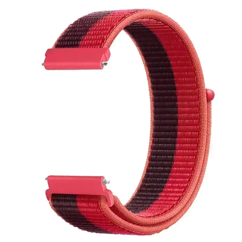 A close-up view of a pink and black striped nylon loop watch strap for a child's watch.