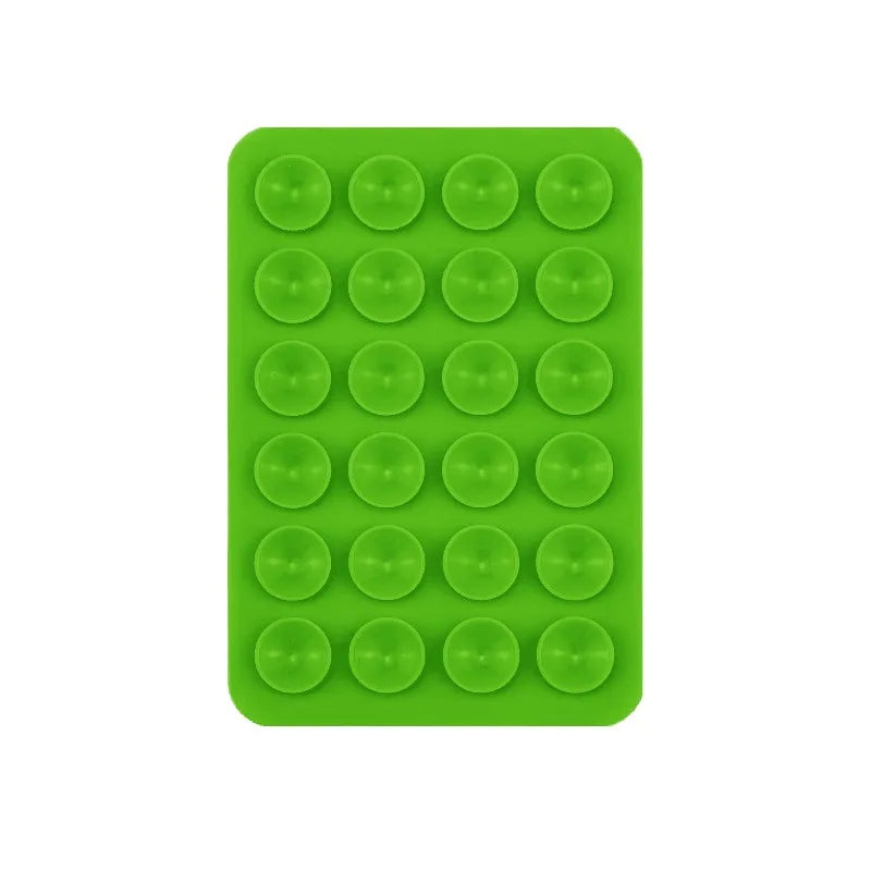 A green silicone suction cup tray with 24 circular cups for mounting phones and tablets.