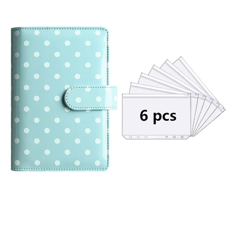 A light blue reusable PU leather binder with white polka dots and a clear plastic sleeve containing six cards.