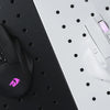 A black wireless MMO gaming mouse with purple RGB lighting is shown on a dark surface next to a white dotted background.