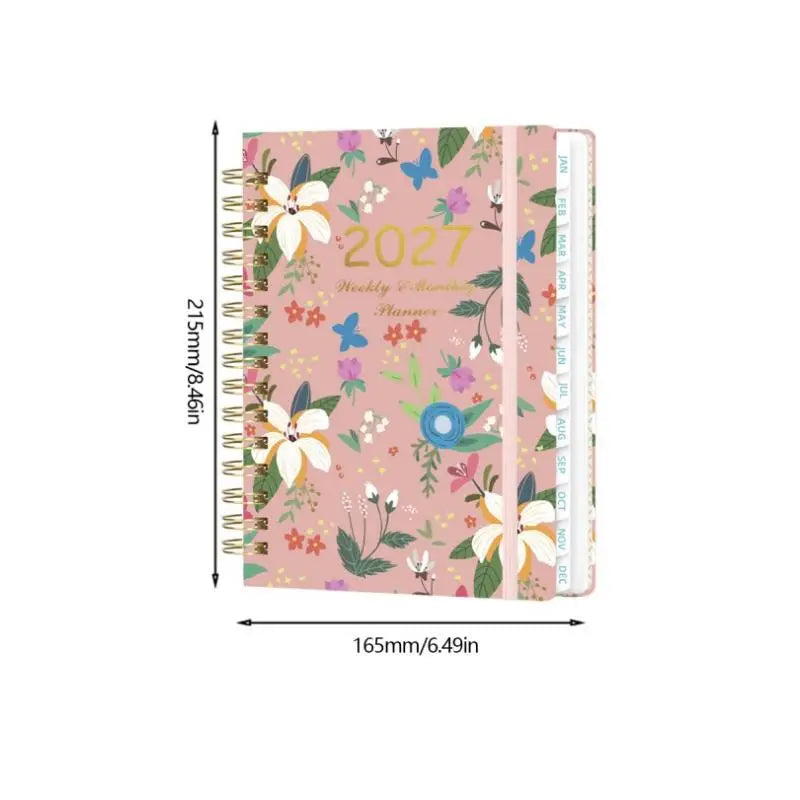 A pink A5 spiral bound planner featuring floral designs and monthly tabs for 2027