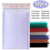 A stack of 50 purple padded bubble mailers with self-seal closures in various sizes and colors.