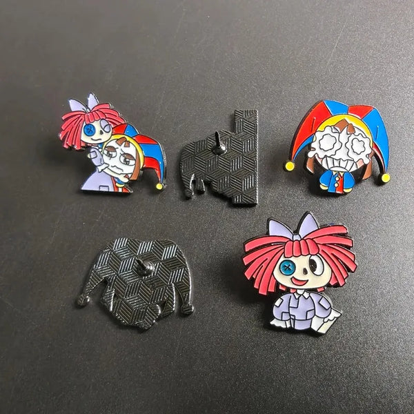 A set of five metal pins featuring cartoon anime characters and designs.