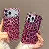 A hand holds a glamorous leopard print sequin shockproof phone case for an iPhone against a neutral background.