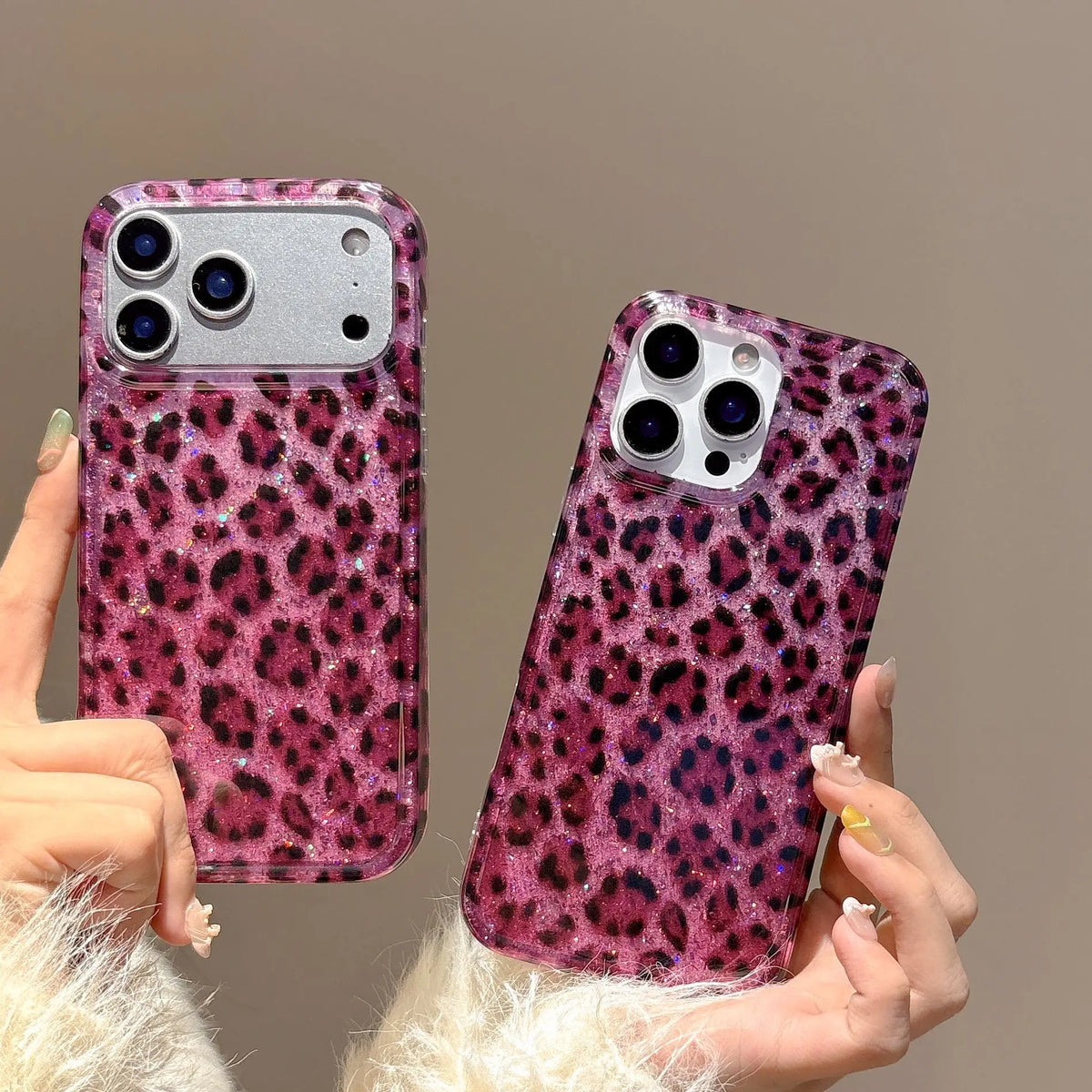 A hand holds a glamorous leopard print sequin shockproof phone case for an iPhone against a neutral background.
