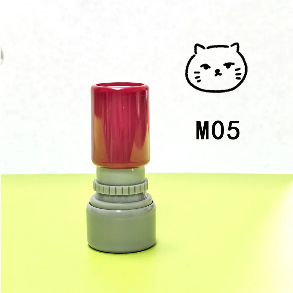 A teacher stamp with a cat face design in red and gray colors.