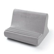 A gray multi-angle adjustable tablet and phone holder with ribbed cushioning.