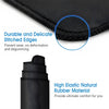 Close-up of a black gaming mouse pad showing durable stitched edges and high elastic natural rubber material