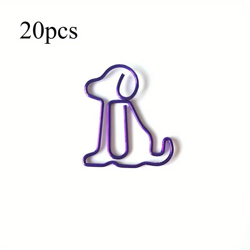 A purple paper clip shaped like a sitting dog, used as a cute desk organizer.