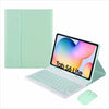 A light mint green leather keyboard case with a detachable Bluetooth keyboard shown next to an iPad.