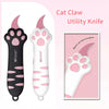 Pink and black utility knife shaped like a cat paw for grooming or similar tasks