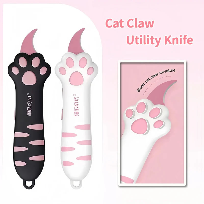 Pink and black utility knife shaped like a cat paw for grooming or similar tasks