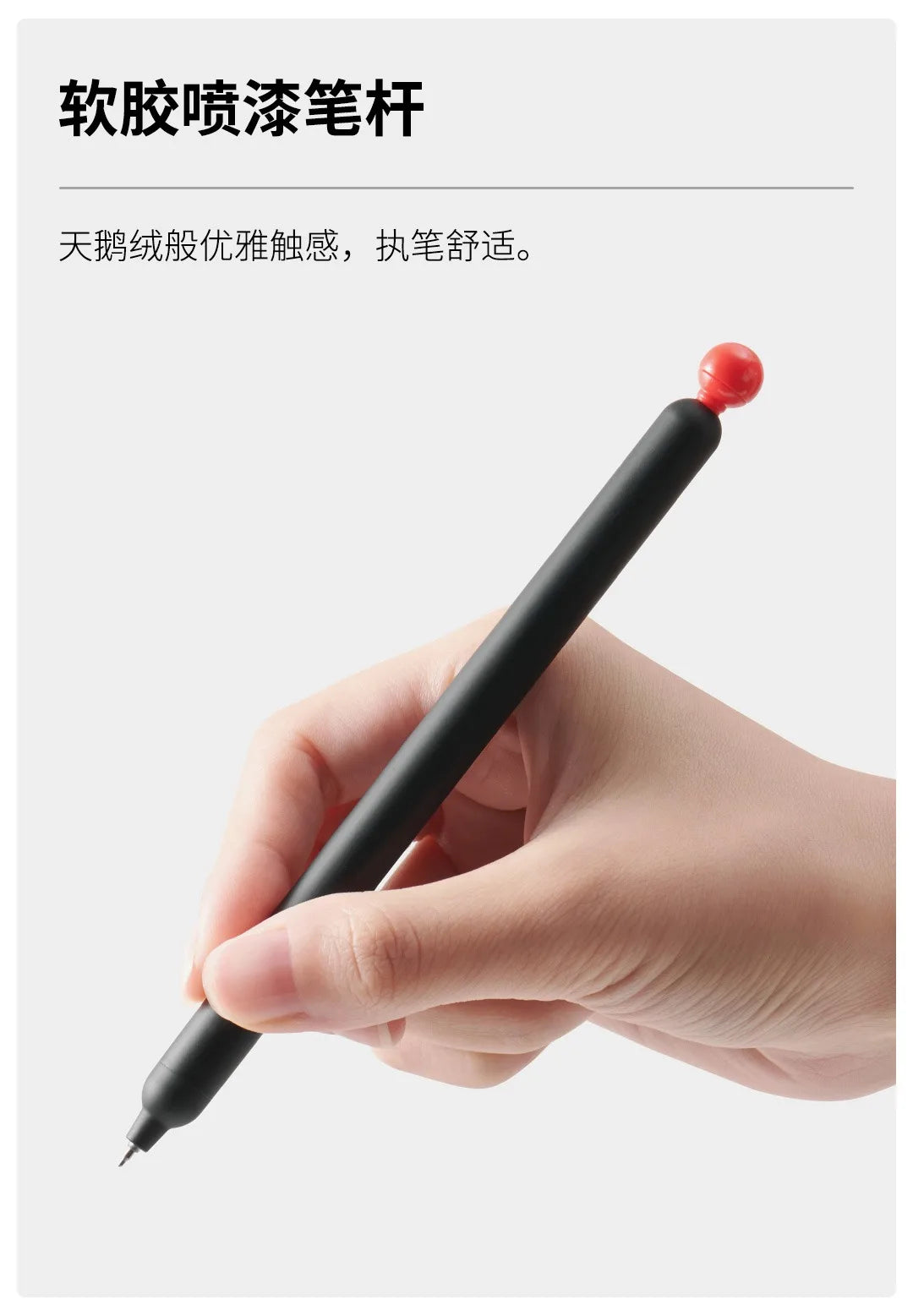 A hand is holding a black smooth gel pen with a red tip, demonstrating its use.