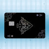 A black card featuring an ornate design and a gold-colored square emblem against a light blue striped background.
