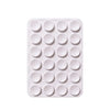 A white silicone suction phone mount with multiple circular holes for mounting devices.