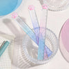A set of clear plastic rulers shaped like cat paws with a gradient color measuring tool displayed on a white surface.