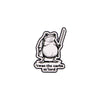 An enamel pin featuring a frog holding a knife with the text I was the carbs m'lord