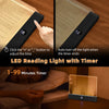 A rechargeable acrylic book night light with a timer is shown illuminating a book.