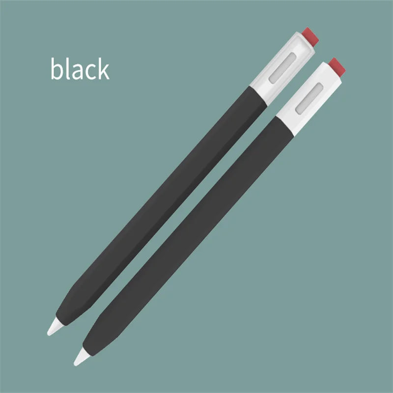 Un stylo noir avec des pointes rouges, montré en diagonale sur un fond vert sourd.