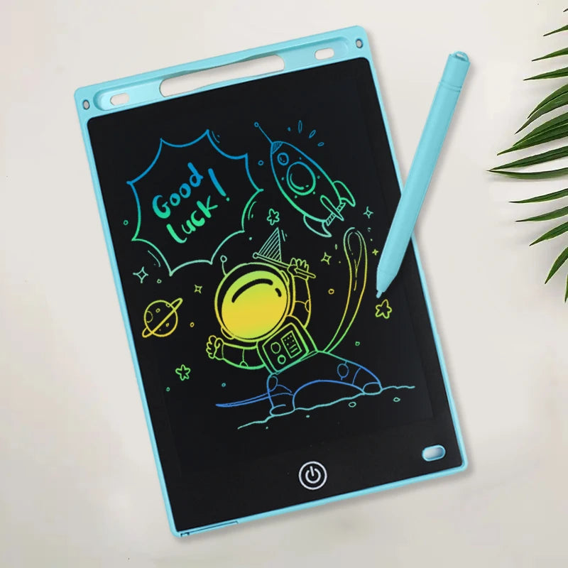 A portable LCD drawing tablet with a light blue frame displays colorful hand-drawn elements like a rocket and a planet on a b
