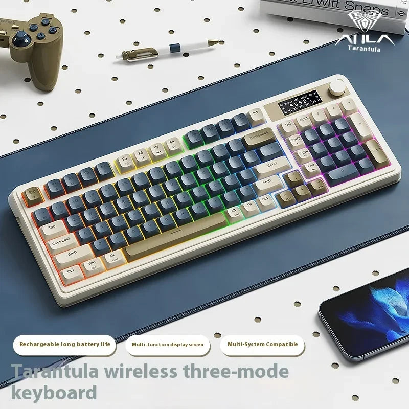 A white wireless three-mode keyboard with blue and purple keys is shown on a dark surface next to a smartphone.