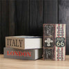 A stack of two leather-bound books titled Italy and London are displayed against a dark wooden background.