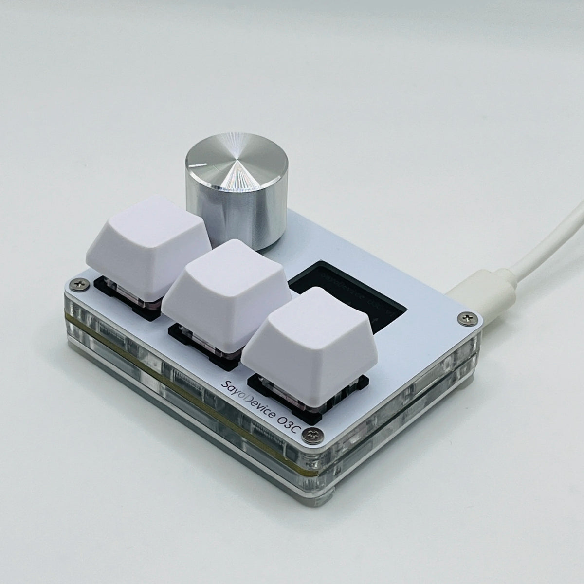 A close-up view of magnetic rapid trigger keyboard switches with a silver top and white switch housings mounted on a circuit 