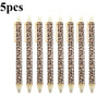Five leopard print retractable ballpoint pens with black ink.