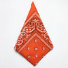Orange cotton bandana square scarf featuring an intricate white paisley print
