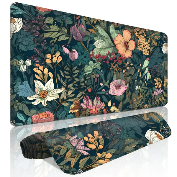 A dark teal floral design mouse pad featuring various shades of pink, green, and yellow foliage.
