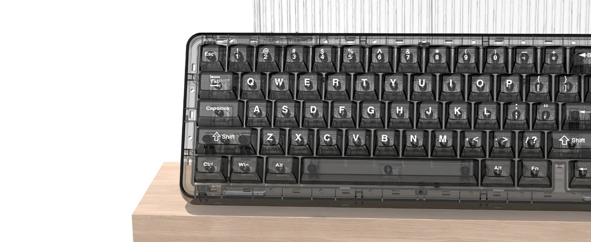 A close-up view of a black mechanical keyboard with crystal clear RGB keycaps resting on a wooden surface.