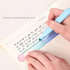 A hand uses a blue straight ruler with a gradient scale to measure text on a notebook page.