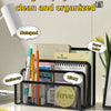 A black metal mesh desk file organizer holding stationery, a diary, and a paper letter on a white desk.