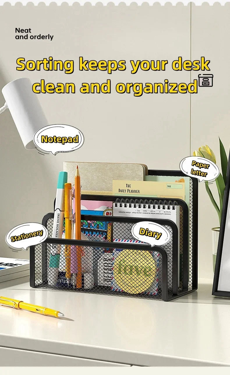 A black metal mesh desk file organizer holding stationery, a diary, and a paper letter on a white desk.