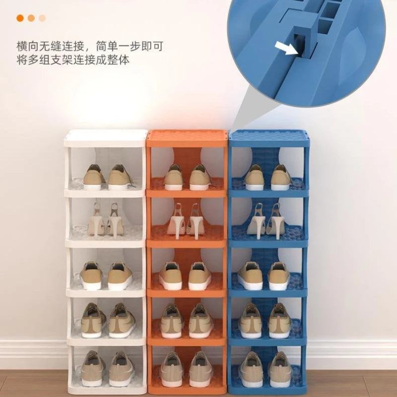 A set of portable plastic shoe hangers in white, beige, and blue colors displayed on a wall.