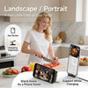 A woman uses a data cable free product to chop vegetables and a phone stand for charging.