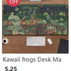 A green desk mat featuring a detailed nature scene with plants and insects, displayed next to a computer setup.