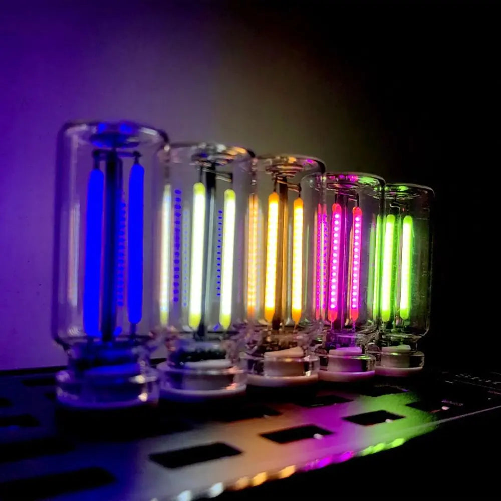 A row of retro Edison USB LED bulbs with touch dimming lights glowing in various colors against a dark background.