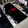 A large black mouse pad featuring a white silhouette of a figure and a red Berserk logo against a starry night background.