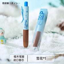 A blue and white retro metal gel pen with a wood grip is shown lying on snow.
