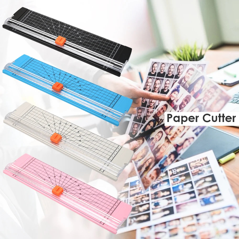 A hand is using a portable manual paper cutter with various colored blades to trim paper for crafting and scrapbooking.