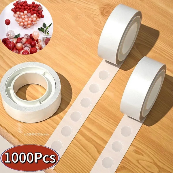 Rolls of clear double-sided adhesive dots for crafts and DIY displayed on a wooden surface.