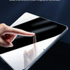 A hand touches a smartphone screen with an oleophobic coating applied, demonstrating fingerprint resistance.