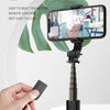 A black Bluetooth selfie stick with an LED fill light is mounted on a tripod stand, demonstrating built-in wireless remote co